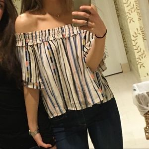 Astr the label over the shoulder top